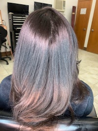 the back of a woman's hair in a salon